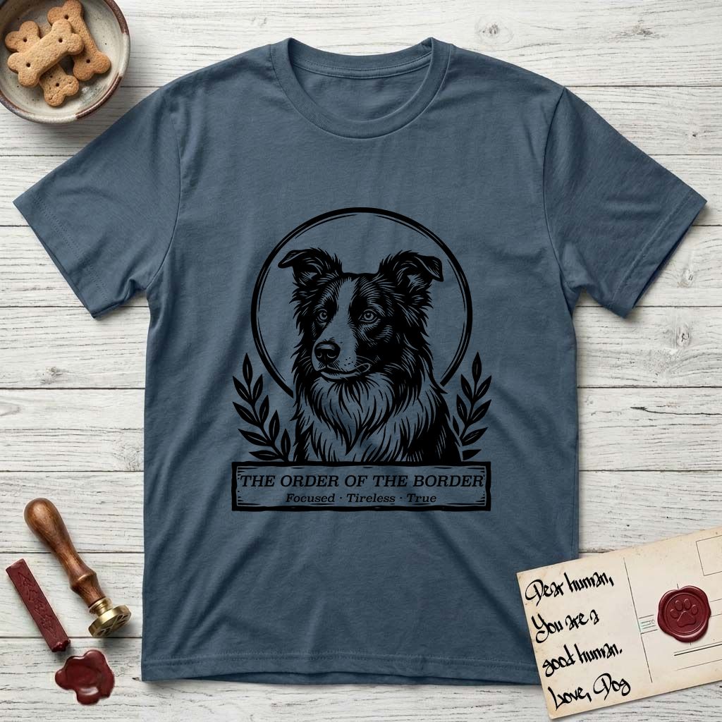 Holy Orders Border Collie T-Shirt flat lay in Indigo Blue, featuring a bold black-and-white linocut saint-medallion portrait of a Border Collie.