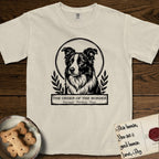 Holy Orders Border Collie T-Shirt flat lay in Ivory, featuring a bold black-and-white linocut saint-medallion portrait of a Border Collie.