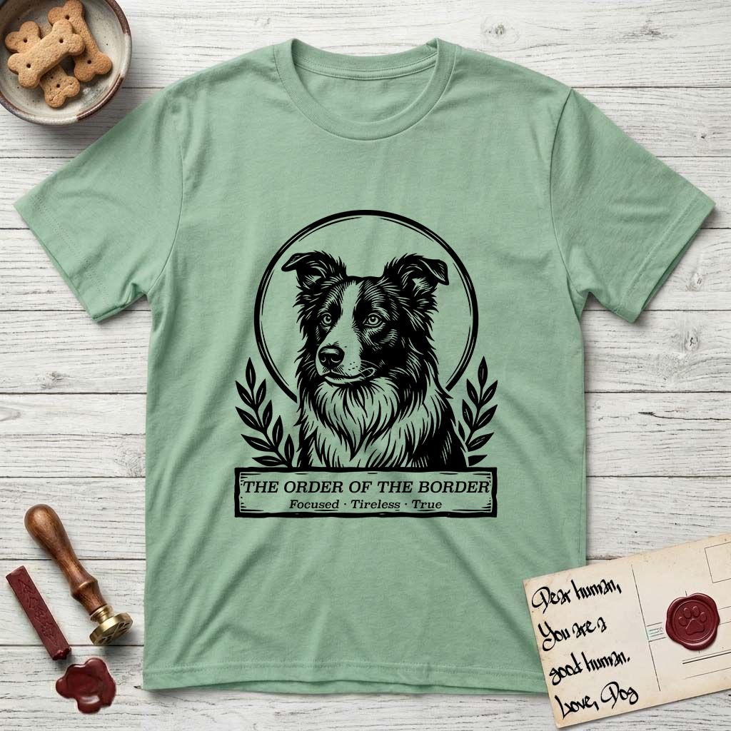 Holy Orders Border Collie T-Shirt flat lay in Mint Green, featuring a bold black-and-white linocut saint-medallion portrait of a Border Collie.
