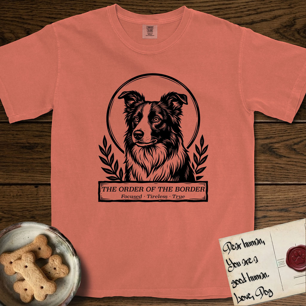 Holy Orders Border Collie T-Shirt flat lay in Terracotta, featuring a bold black-and-white linocut saint-medallion portrait of a Border Collie.