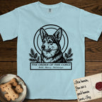 Holy Orders Corgi T-Shirt flat lay in Chambray, featuring a bold black-and-white linocut saint-medallion portrait of a Corgi.