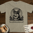Holy Orders Corgi T-Shirt flat lay in Khaki, featuring a bold black-and-white linocut saint-medallion portrait of a Corgi.