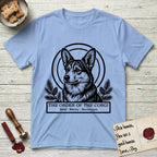 Holy Orders Corgi T-Shirt flat lay in Light Blue, featuring a bold black-and-white linocut saint-medallion portrait of a Corgi.