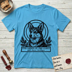 Holy Orders Corgi T-Shirt flat lay in Sky, featuring a bold black-and-white linocut saint-medallion portrait of a Corgi.