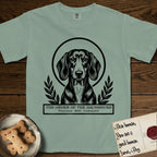 Holy Orders Dachshund T-Shirt flat lay in Bay, featuring a bold black-and-white linocut saint-medallion portrait of a Dachshund.