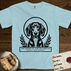 Holy Orders Dachshund T-Shirt flat lay in Chambray, featuring a bold black-and-white linocut saint-medallion portrait of a Dachshund.