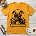 Holy Orders French Bulldog T-Shirt flat lay in Gold, featuring a bold black-and-white linocut saint-medallion portrait of a French Bulldog.