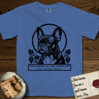 Holy Orders French Bulldog T-Shirt flat lay in Mystic Blue, featuring a bold black-and-white linocut saint-medallion portrait of a French Bulldog.