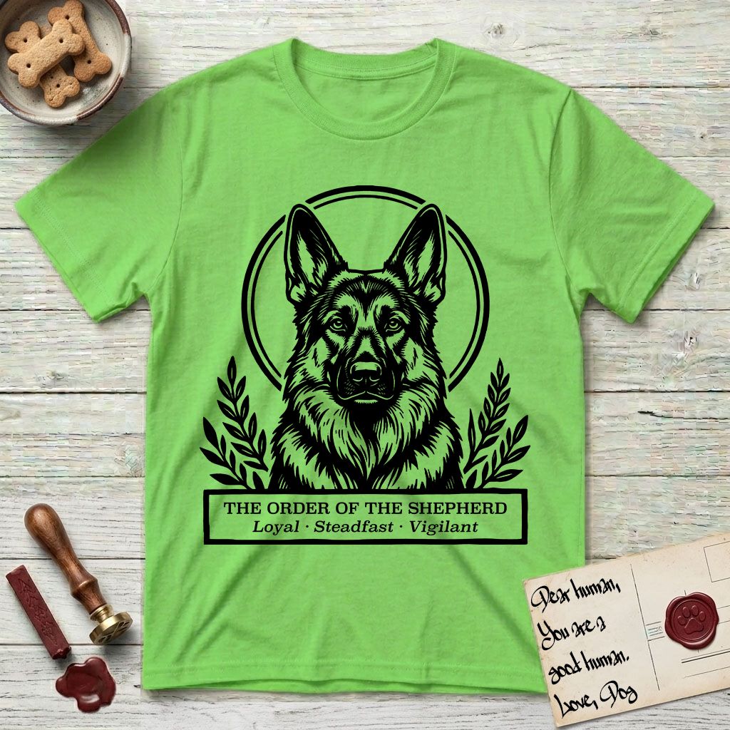 Holy Orders German Shepherd T-Shirt flat lay in Lime, featuring a bold black-and-white linocut saint-medallion portrait of a German Shepherd.