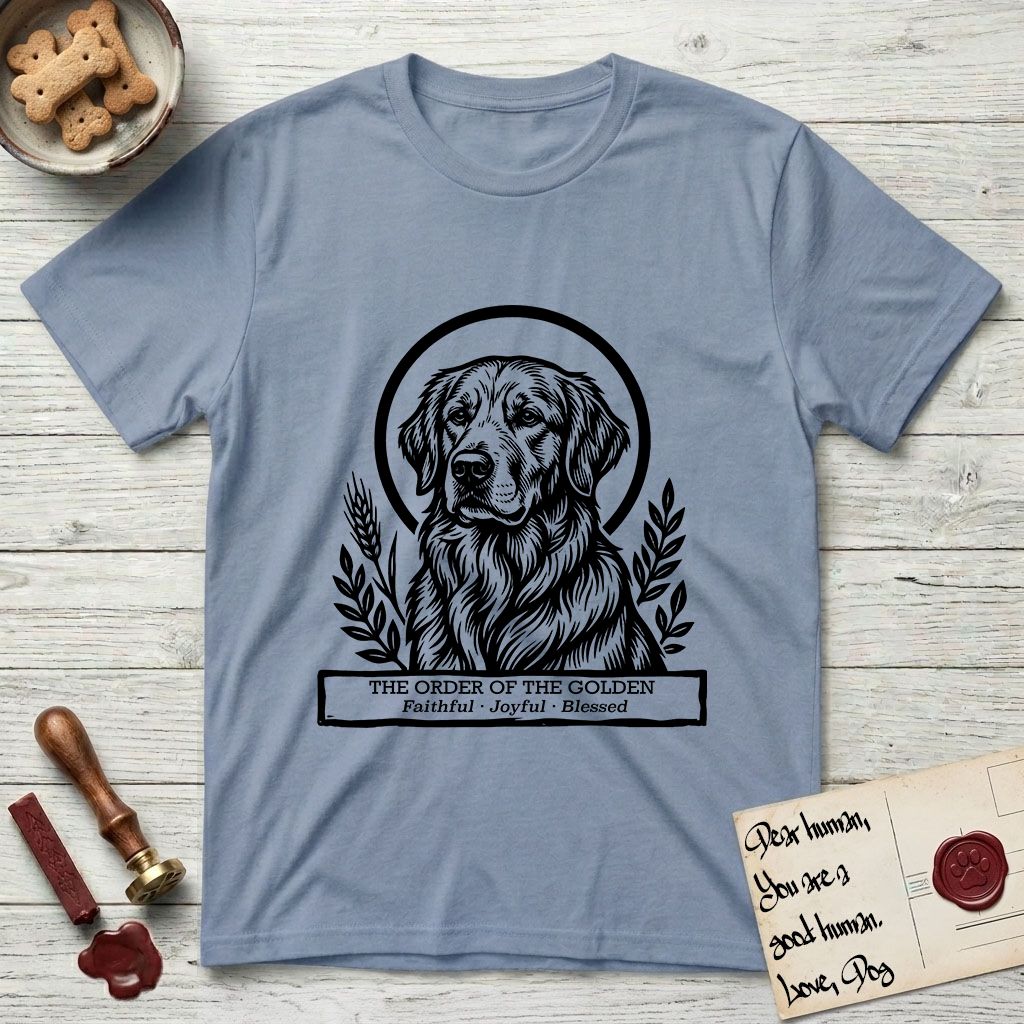 Holy Orders Golden Retriever T-Shirt flat lay in Stone Blue, featuring a bold black-and-white linocut saint-medallion portrait of a Golden Retriever.
