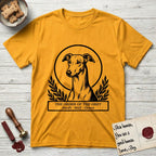 Holy Orders Greyhound T-Shirt flat lay in Gold, featuring a bold black-and-white linocut saint-medallion portrait of a Greyhound.