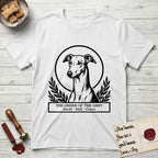 Holy Orders Greyhound T-Shirt flat lay in White, featuring a bold black-and-white linocut saint-medallion portrait of a Greyhound.