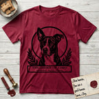 Holy Orders Lobo T-Shirt flat lay in Antique Cherry Red, featuring a bold black-and-white linocut saint-medallion portrait of Lobo, an Australian Cattle Dog and Pitbull mix with a white facial blaze.