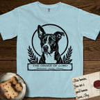 Holy Orders Lobo T-Shirt flat lay in Chambray, featuring a bold black-and-white linocut saint-medallion portrait of Lobo, an Australian Cattle Dog and Pitbull mix with a white facial blaze.