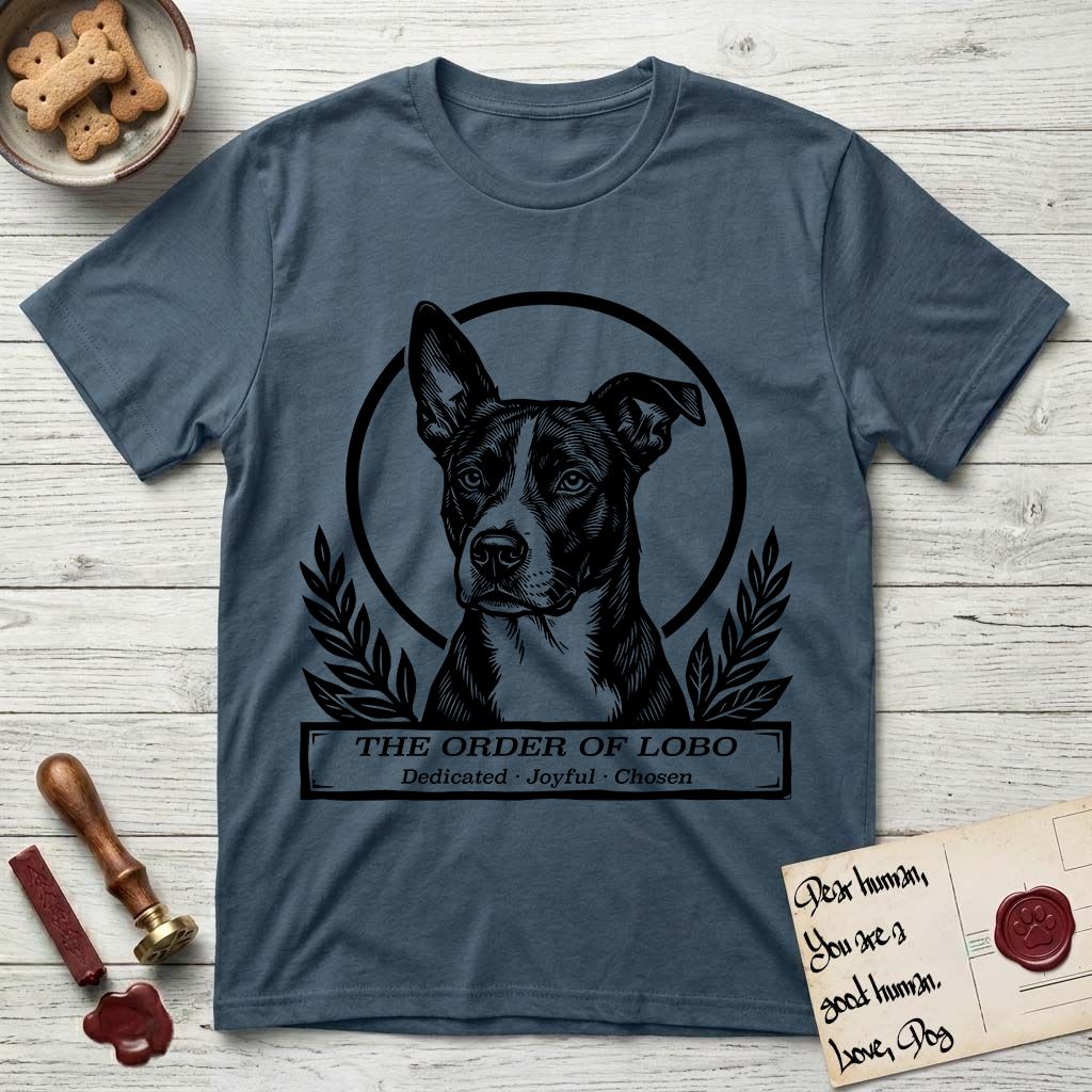 Holy Orders Lobo T-Shirt flat lay in Indigo Blue, featuring a bold black-and-white linocut saint-medallion portrait of Lobo, an Australian Cattle Dog and Pitbull mix with a white facial blaze.
