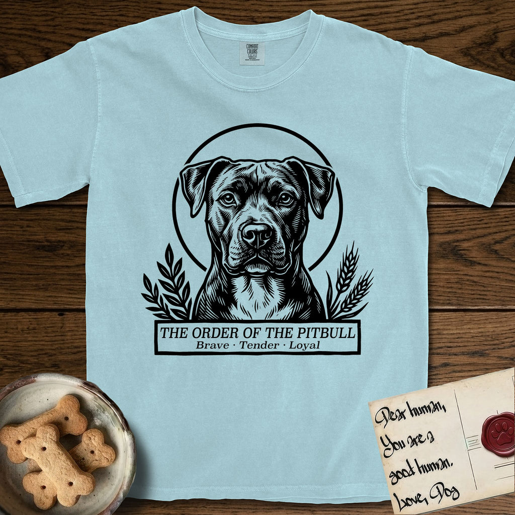 Holy Orders Pitbull T-Shirt flat lay in Chambray, featuring a bold black-and-white linocut saint-medallion portrait of a Pitbull.