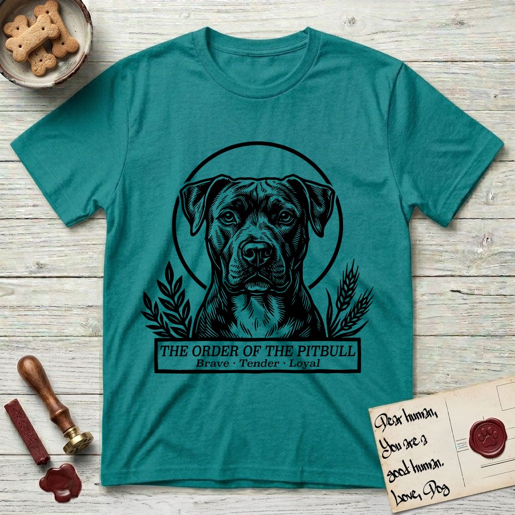 Holy Orders Pitbull T-Shirt flat lay in Jade Dome, featuring a bold black-and-white linocut saint-medallion portrait of a Pitbull.