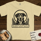 Holy Orders Rescue Mutt T-Shirt flat lay in Butter, featuring a bold black-and-white linocut saint-medallion portrait of a rescue mutt.
