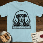 Holy Orders Rescue Mutt T-Shirt flat lay in Chambray, featuring a bold black-and-white linocut saint-medallion portrait of a rescue mutt.