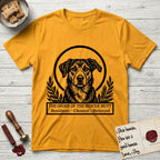 Holy Orders Rescue Mutt T-Shirt flat lay in Gold, featuring a bold black-and-white linocut saint-medallion portrait of a rescue mutt.