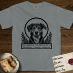 Holy Orders Rescue Mutt T-Shirt flat lay in Granite, featuring a bold black-and-white linocut saint-medallion portrait of a rescue mutt.