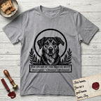 Holy Orders Rescue Mutt T-Shirt flat lay in Sport Grey, featuring a bold black-and-white linocut saint-medallion portrait of a rescue mutt.