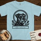 Holy Orders Schnauzer T-Shirt flat lay in Chambray, featuring a bold black-and-white linocut saint-medallion portrait of a Schnauzer.