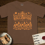 Hallowtide Australian Cattle Dog T-Shirt flat lay in Espresso, featuring Orange one-color gothic illustration of three haloed speckled Australian Cattle Dogs walking in procession carrying a skeleton key, a scary jack-o'-lantern, and an iron lantern, under the blackletter headline HALLOWTIDE.