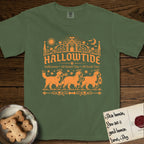 Hallowtide Bernese Mountain Dog T-Shirt flat lay in Moss, featuring Orange one-color gothic illustration of three haloed Bernese Mountain Dogs walking in procession carrying a skeleton key, a scary jack-o'-lantern, and an iron lantern, under the blackletter headline HALLOWTIDE.