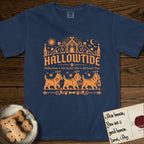 Hallowtide Cairn Terrier T-Shirt flat lay in True Navy, featuring Orange one-color gothic illustration of three haloed shaggy Cairn Terriers walking in procession carrying a skeleton key, a scary jack-o'-lantern, and an iron lantern, under the blackletter headline HALLOWTIDE.