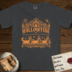 Hallowtide Corgi T-Shirt flat lay in Graphite, featuring Orange one-color gothic illustration of three haloed Corgis walking in procession carrying a skeleton key, a scary jack-o'-lantern, and an iron lantern, under the blackletter headline HALLOWTIDE.