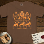 Hallowtide Doberman T-Shirt flat lay in Espresso, featuring Orange one-color gothic illustration of three haloed Dobermans walking in procession carrying a skeleton key, a scary jack-o'-lantern, and an iron lantern, under the blackletter headline HALLOWTIDE.