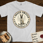 I Stand Amazed in the Presence Belgian Malinois T-Shirt flat lay in White, featuring a vintage engraving medallion of a haloed Belgian Malinois with a small devoted human gazing up from below.