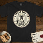 I Stand Amazed in the Presence Chihuahua T-Shirt flat lay in Black, featuring a vintage engraving medallion of a haloed Chihuahua with a small devoted human gazing up from below.