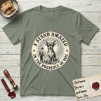 I Stand Amazed in the Presence Chihuahua T-Shirt flat lay in Sage, featuring a vintage engraving medallion of a haloed Chihuahua with a small devoted human gazing up from below.