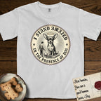 I Stand Amazed in the Presence Chihuahua T-Shirt flat lay in White, featuring a vintage engraving medallion of a haloed Chihuahua with a small devoted human gazing up from below.