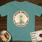 I Stand Amazed in the Presence Golden Retriever T-Shirt flat lay in Blue Spruce, featuring a vintage engraving medallion of a haloed Golden Retriever with a small devoted human gazing up from below.
