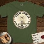 I Stand Amazed in the Presence Golden Retriever T-Shirt flat lay in Hemp, featuring a vintage engraving medallion of a haloed Golden Retriever with a small devoted human gazing up from below.