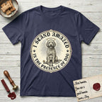 I Stand Amazed in the Presence Goldendoodle T-Shirt flat lay in Navy, featuring a vintage engraving medallion of a haloed Goldendoodle with a small devoted human gazing up from below.