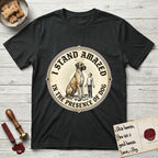 I Stand Amazed in the Presence Great Dane T-Shirt flat lay in Black, featuring a vintage engraving medallion of a haloed Great Dane with a small devoted human gazing up from below.