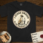 I Stand Amazed in the Presence Great Dane T-Shirt flat lay in Black, featuring a vintage engraving medallion of a haloed Great Dane with a small devoted human gazing up from below.
