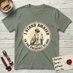 I Stand Amazed in the Presence Great Dane T-Shirt flat lay in Sage, featuring a vintage engraving medallion of a haloed Great Dane with a small devoted human gazing up from below.