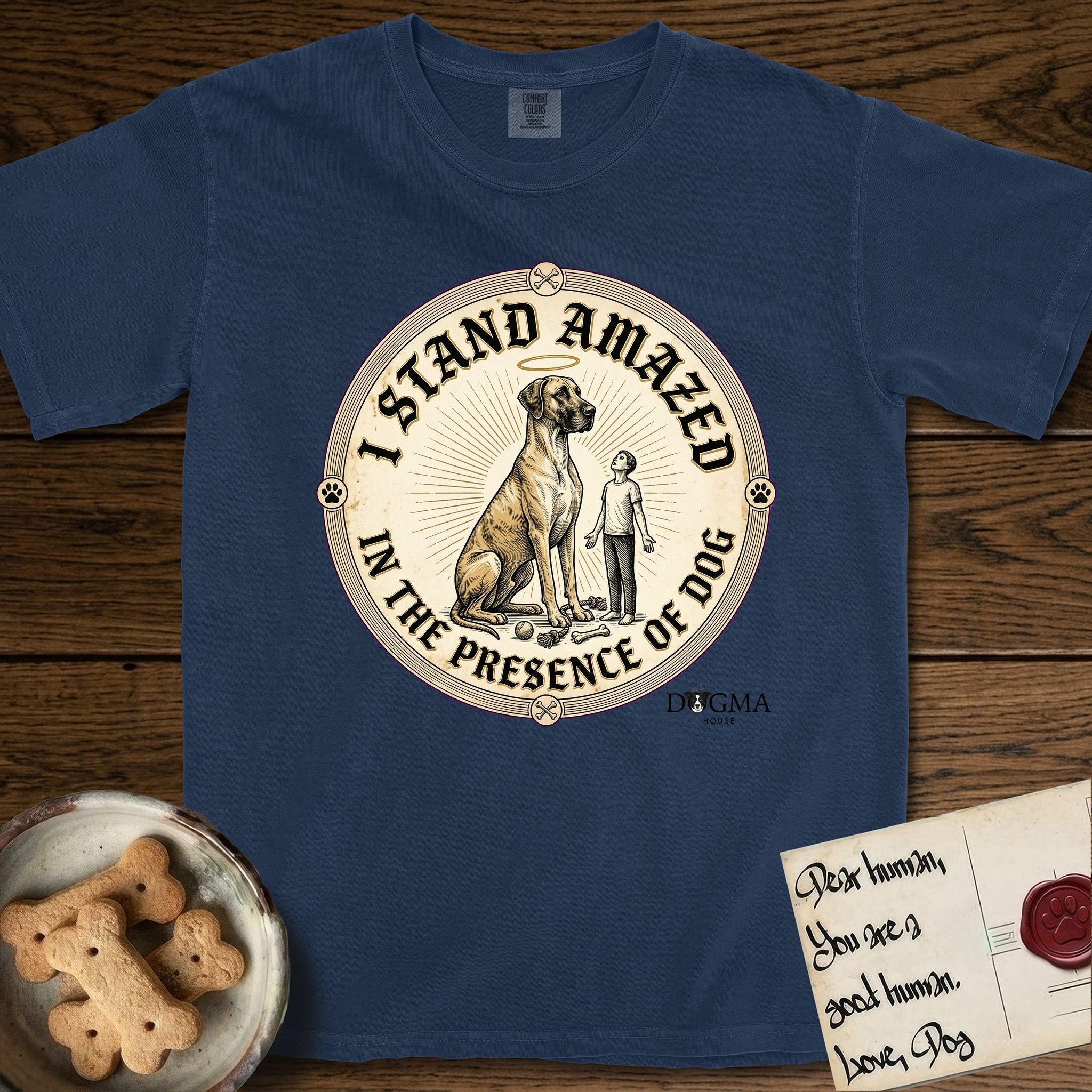 I Stand Amazed in the Presence Great Dane T-Shirt flat lay in True Navy, featuring a vintage engraving medallion of a haloed Great Dane with a small devoted human gazing up from below.