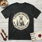 I Stand Amazed in the Presence Pitbull T-Shirt flat lay in Black, featuring a vintage engraving medallion of a haloed Pitbull with a small devoted human gazing up from below.