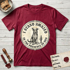 I Stand Amazed in the Presence Rescue Mutt T-Shirt flat lay in Antique Cherry Red, featuring a vintage engraving medallion of a haloed rescue mutt with a small devoted human gazing up from below.