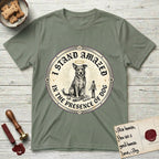 I Stand Amazed in the Presence Rescue Mutt T-Shirt flat lay in Sage, featuring a vintage engraving medallion of a haloed rescue mutt with a small devoted human gazing up from below.