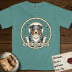 Let Go and Let Dog Australian Shepherd T-Shirt flat lay in Blue Spruce, featuring an antique celestial star chart with a haloed blue merle Australian Shepherd at the center, paws raised, stars scattered through her coat.