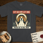 Let Go and Let Dog Beagle T-Shirt flat lay in Graphite, featuring a vintage seed packet label with a haloed tricolor Beagle, paws raised, flanked by simple flower sprigs.