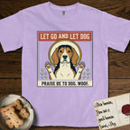 Let Go and Let Dog Beagle T-Shirt flat lay in Orchid, featuring a vintage seed packet label with a haloed tricolor Beagle, paws raised, flanked by simple flower sprigs.