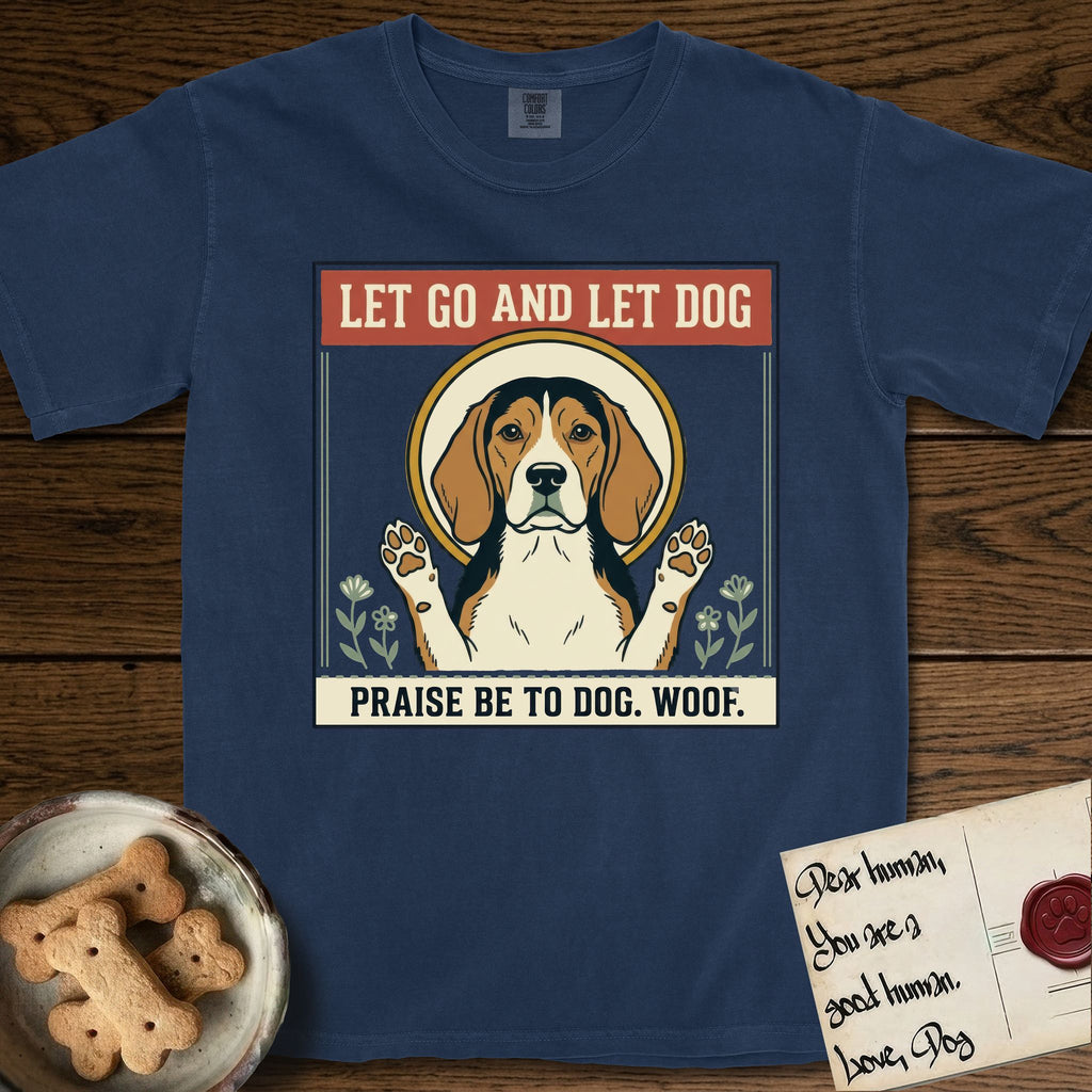 Let Go and Let Dog Beagle T-Shirt flat lay in True Navy, featuring a vintage seed packet label with a haloed tricolor Beagle, paws raised, flanked by simple flower sprigs.